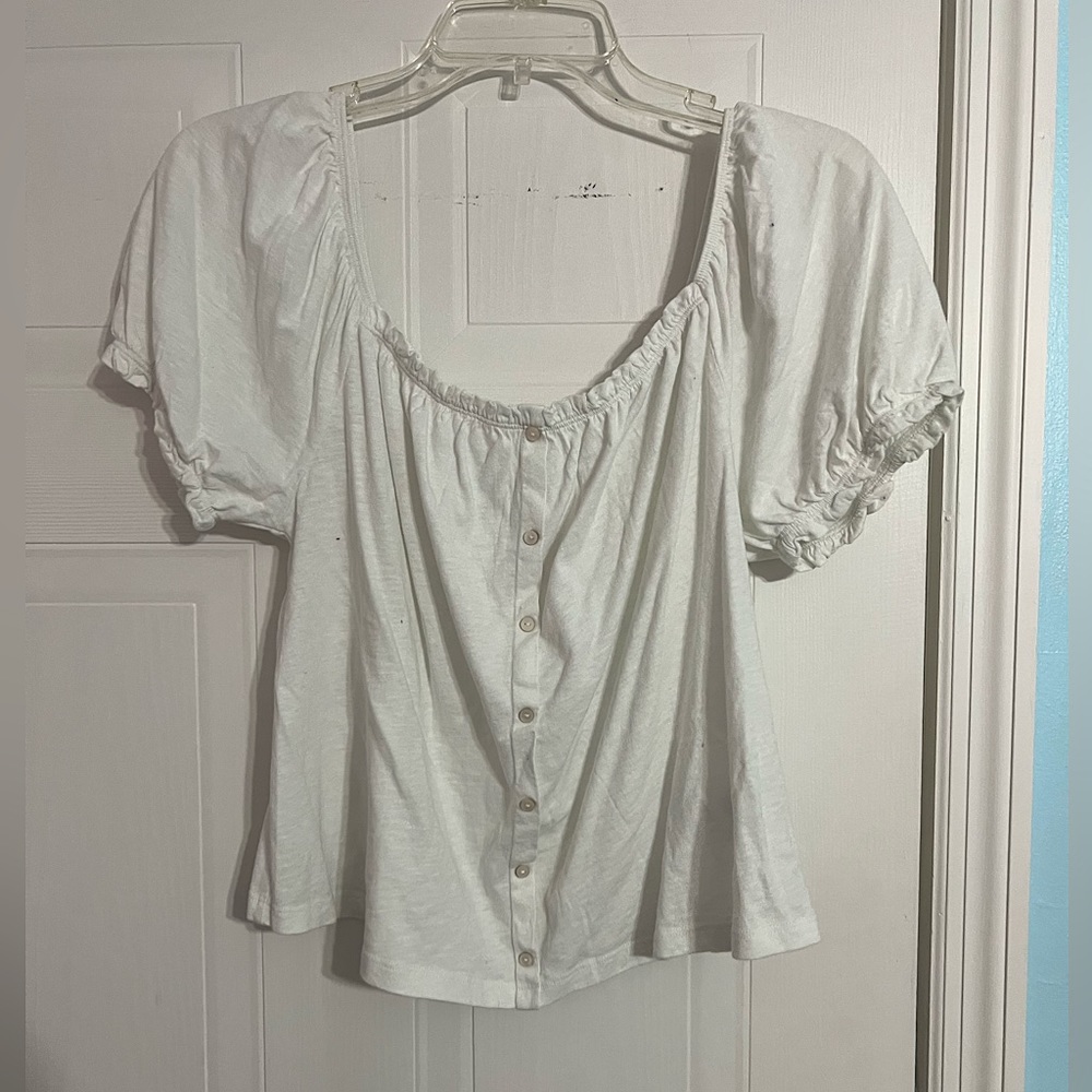 a cute, white, off the shoulder, button down shirt